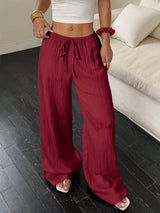Flirla Women's Casual Solid Color Textured Fabric Knotted Waist Slant Pocket Wide Leg Pants Fall Cloth