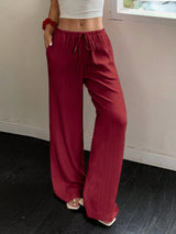 Flirla Women's Casual Solid Color Textured Fabric Knotted Waist Slant Pocket Wide Leg Pants Fall Cloth