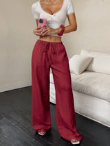 Flirla Women's Casual Solid Color Textured Fabric Knotted Waist Slant Pocket Wide Leg Pants Fall Cloth