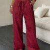 Flirla Women's Casual Solid Color Textured Fabric Knotted Waist Slant Pocket Wide Leg Pants Fall Cloth